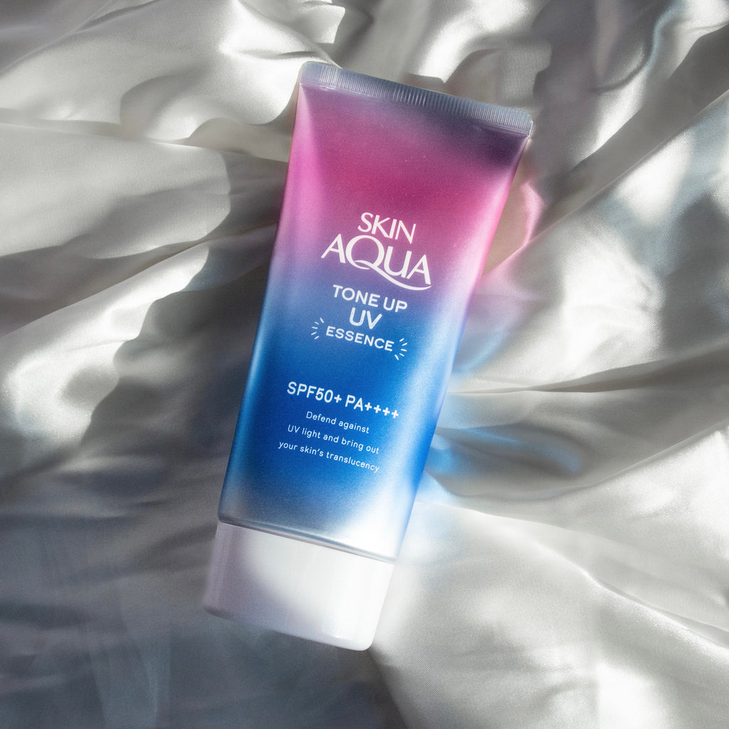 Skin Aqua Tone Up UV Essence japanese sunscreen lifestyle photo product lying on the ground cloth high quality product review スキンアクアトーンアップ UV エッセンス